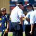 Michigan head coach Carol Hutchins paces around umpires as they deliberate a call in the game against Louisiana-Lafayette on Saturday, May 25. Daniel Brenner I AnnArbor.com